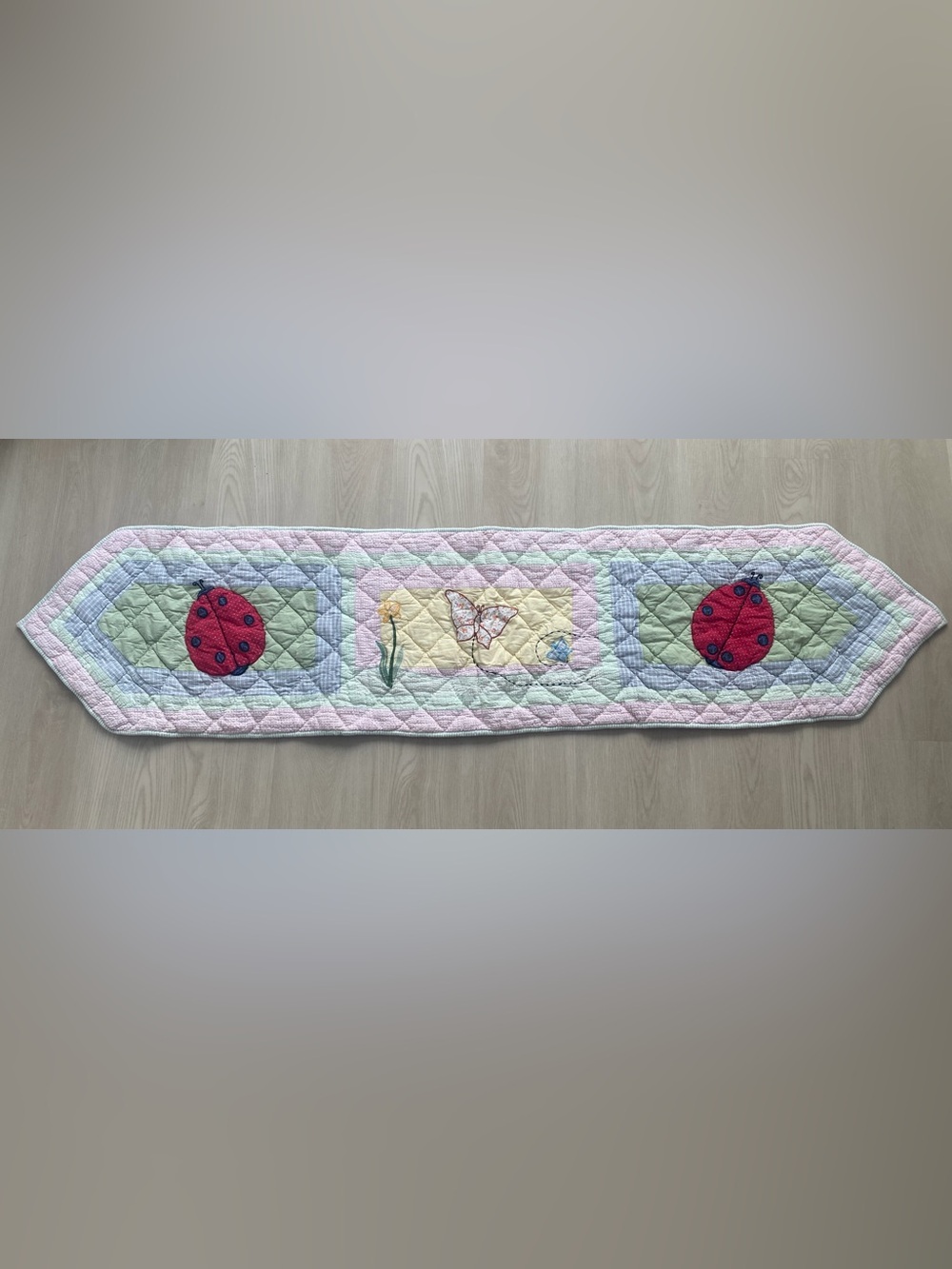 Patch Magic 100% cotton quilted runner. Ladybug motif